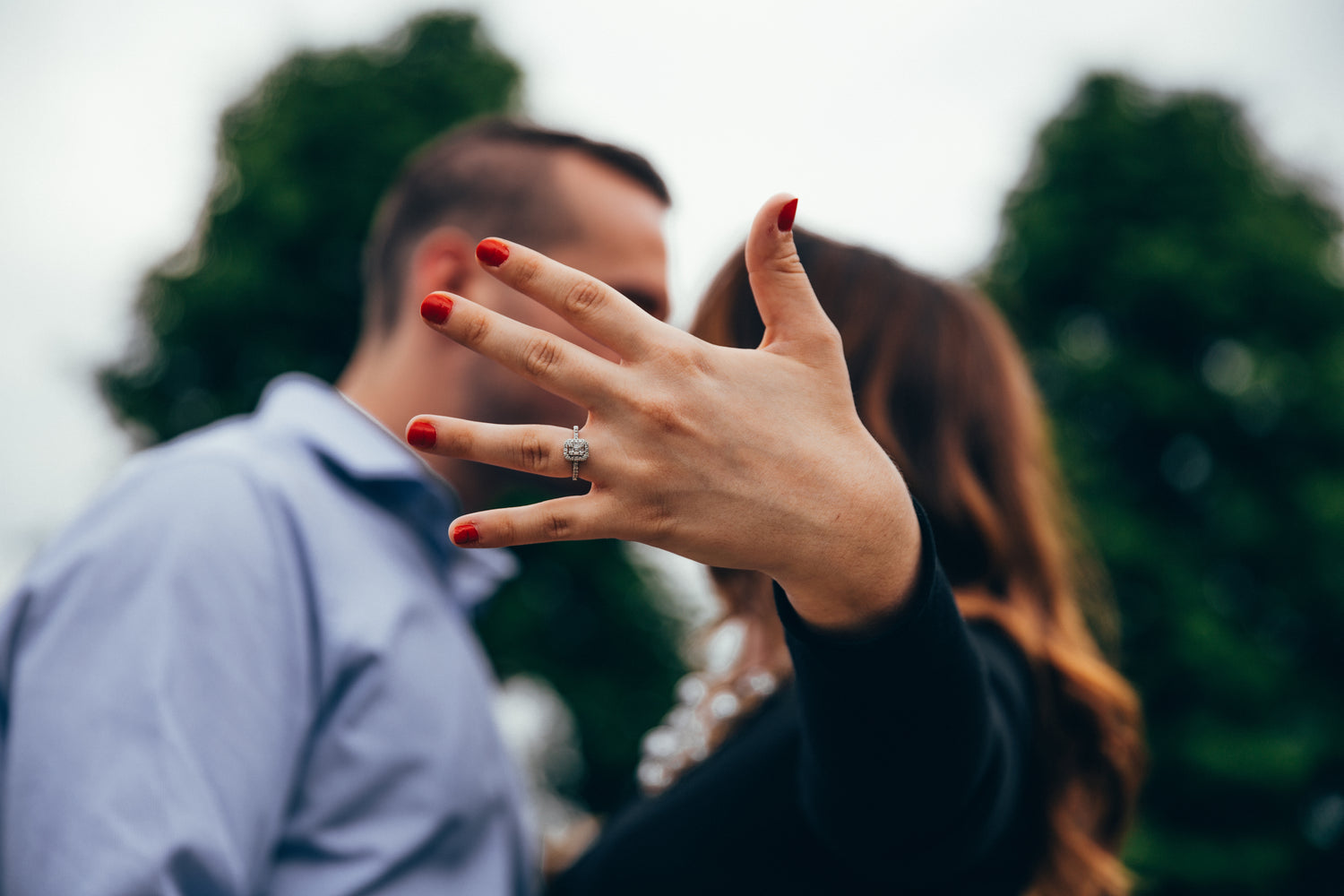 Lady showing off engagement ring