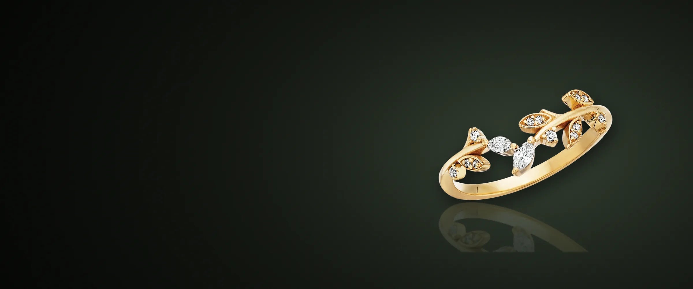 Yellow gold vine ring with marquise diamond leaves