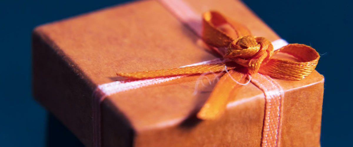 Orange gift box with a ribbon