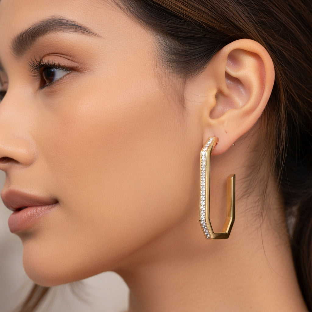 Ladies face with yellow gold earring on. 